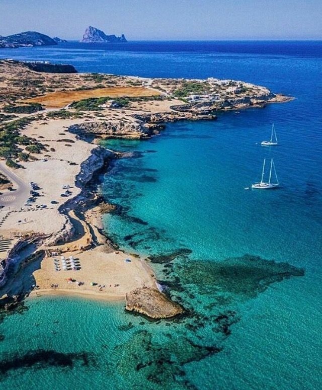 Trippy Travels - Spain - Cala Comte Beach Travel Experience Cala Comte Beach in Spain for Trippy Travels destination guide and curated itinerary