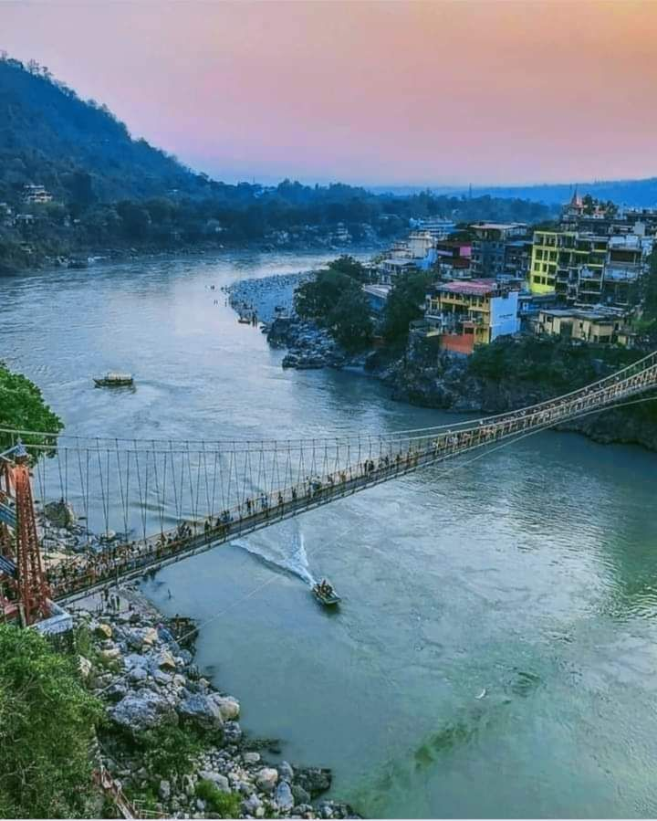 Trippy Travels - Rishikesh - Laxman Jhula Suspension Bridge Travel Experience Laxman Jhula Suspension Bridge in Rishikesh for Trippy Travels destination guide and curated itinerary